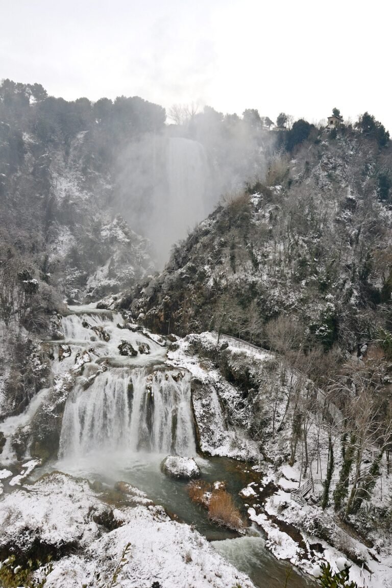 Marmore Falls under snow, the water dropping through a white winter landscape
