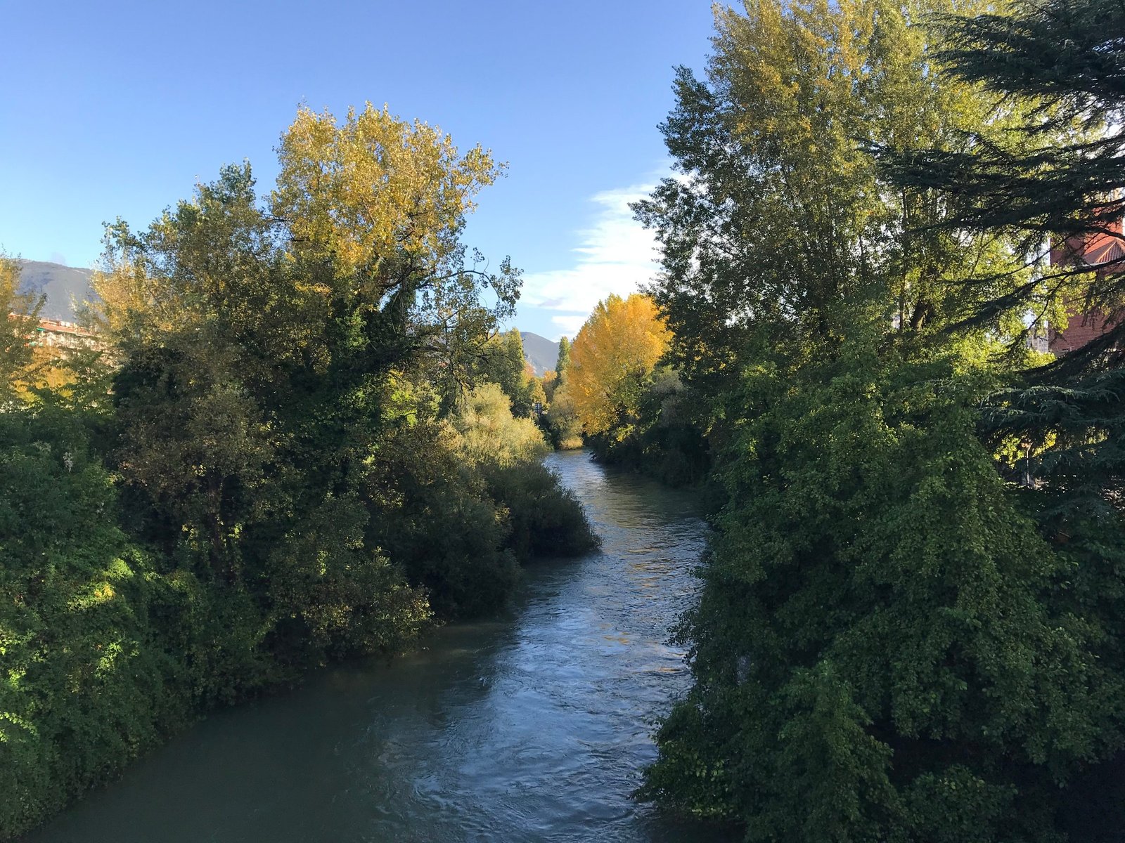 The river Nera in autumn, the trees along its banks turning yellow