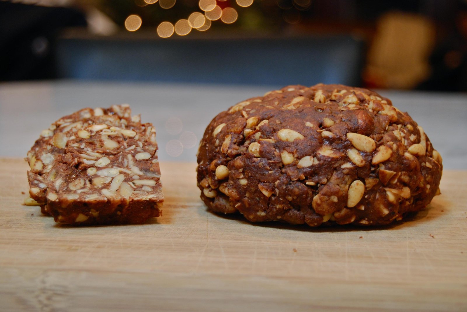 A dark spiced panpepato cake, sliced to show the dense fruit and nut filling