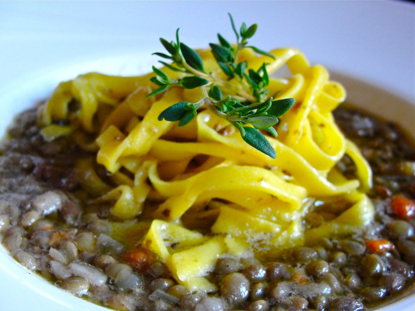 A plate of strangozzi pasta served with lentils